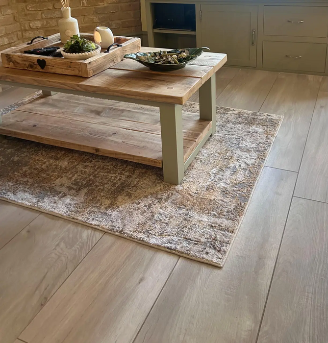 Photo by Julie S. | Wooden coffee table with decorative items on aROS03_Ivory_Gold rug