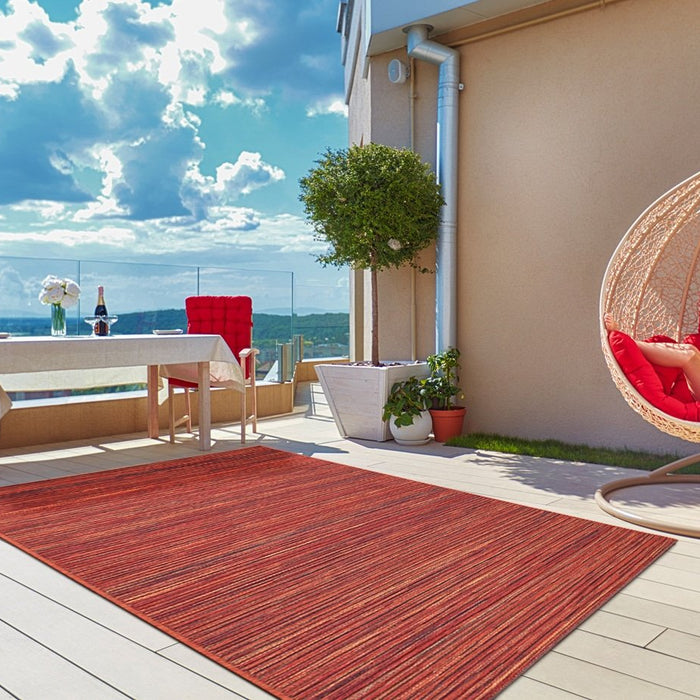 young boy relaxing in hammock on modern rooftop patio, home terrace