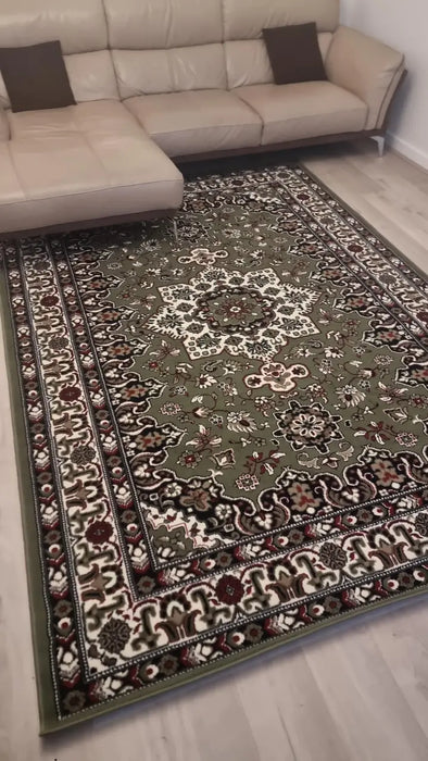 Asimah S.| Decorative rug with intricate patterns in a living room setting.