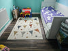 Photo By Petya G. | Children's bedroom with a patterned rug, bed, and toys.