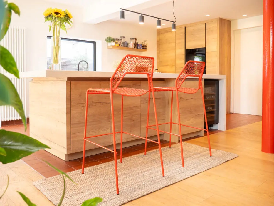 Photo By Nick A | Modern kitchen with wooden island and red bar stools on Boucle Rug