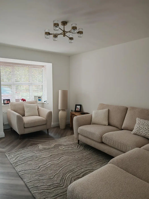 Photo By Michael R. | Living room with beige sofa, armchair, and GRU01 Grey rug