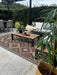 Photo By @renovatingcartrefle | Outdoor patio with furniture, rug, and plants