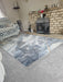 Photo By Vikki P. | Living room with a patterned rug, sofa, and brick fireplace.