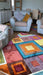 Photo By Cathertine O. | Multicolored patchwork rug in a living room with furniture.